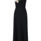 The Lela Rose 3D Peony Embroidered Fluid Crepe Twisted Detail Dress features a sleeveless black design, asymmetrical neckline, and two light pink peony accents on the left shoulder, crafted from soft crepe.