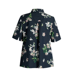 The Erdem Floral Cotton Short Sleeve Shirt features a dark navy cotton poplin with a white and pink orchid print, styled with a collar and short sleeves, shown from the back against a plain background.