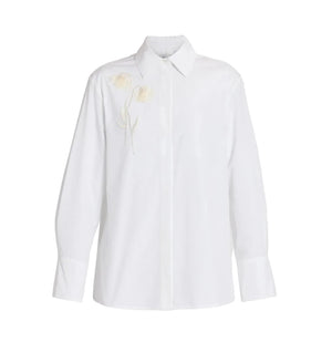 The Erdem Floral Embroidered Long Sleeve Shirt features a classic collar, white cotton poplin fabric, and subtle floral embroidery on the left chest.