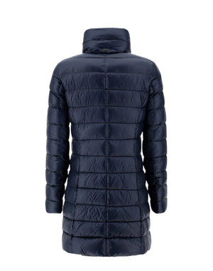 The Herno Maria Jacket, a long dark blue puffer in ultralight nylon with horizontal stitching, is displayed from the back against a plain white background, showcasing signature Herno style.