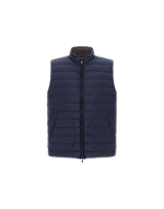 The Herno Quilted Reversible Vest is shown on a plain white background, featuring a navy blue quilted nylon design with injected down padding for added warmth. It includes a front zipper closure and two side pockets.