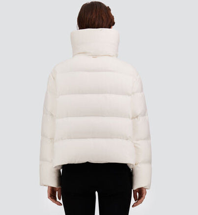 Back view of a white, eco-friendly water-repellent Herno Cashmere Silk Jacket, a cropped puffer with an oversized collar, worn over black trousers.