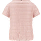 A light pink, short-sleeved Herno Emilia Cape with goose down padding is displayed from the back, highlighting its distinctive design.