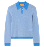 The Guest in Residence Pique LS Shrunken Polo is a light blue women’s long-sleeve sweater featuring a textured pique stitch, blue collar, cuffs, waistband, and a classic three-button placket for timeless style.