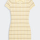 The Plaid Polo Dress by Guest in Residence features short sleeves, a collared neckline, and a buttoned placket, crafted from yellow and beige plaid silk linen blend.