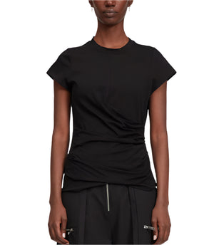 A person wears the 3.1 Phillip Lim Draped SS T-Shirt, a fitted black mercerized cotton jersey with side ruching, paired with black tailored trousers featuring front zippers.