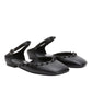 A pair of ID Mary Jane Flat Leather Craft shoes by 3.1 Phillip Lim in black, with ankle straps, decorative small bows around the edges, and a sculpted toe design.