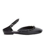 3.1 Phillip Lim ID Mary Jane Flat Leather Craft, a black flat shoe with a sculpted toe, features an ankle strap and decorative studs along the edge.