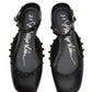 Black ID Mary Jane Flat Leather Craft sandals by 3.1 Phillip Lim feature a sculpted toe, ankle strap, leather knots, and pom-poms with a white signature on the insole.