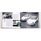 An open book, "Porsche 70 Years: There is No Substitute" by Graphic Image, displays black and white photos and text highlighting iconic moments, including two white Porsche 911s parked side by side.