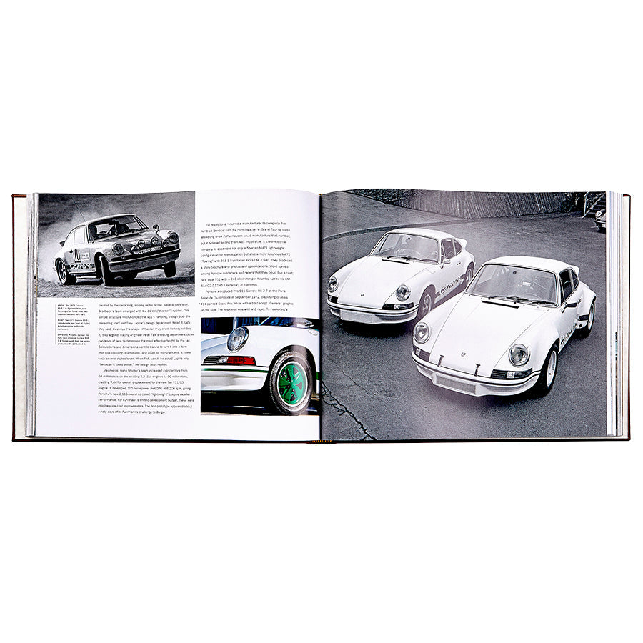 An open book, "Porsche 70 Years: There is No Substitute" by Graphic Image, displays black and white photos and text highlighting iconic moments, including two white Porsche 911s parked side by side.