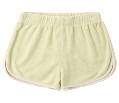 The Girls' Track Short by Rylee & Cru is a light yellow terry cloth short with an elastic waistband and white trim, shown flat with the back up—ideal summer shorts for relaxed comfort.