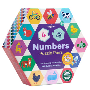 The Eeboo Numbers Hexagon Puzzle Pairs is a hexagon-shaped puzzle box with animal illustrations and numbers, designed for ages 3+ to teach counting and simple math skills.