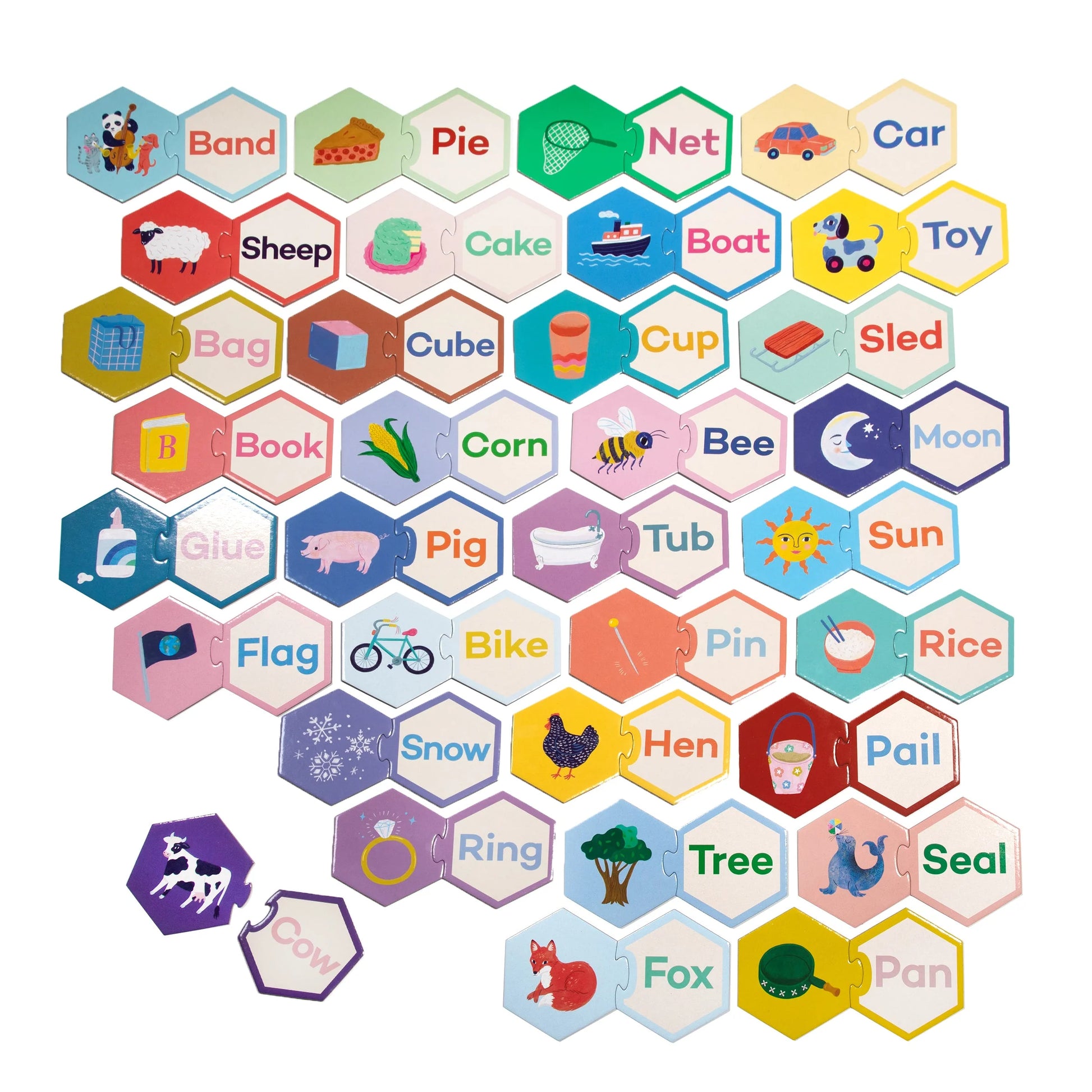 The Eeboo Simple Words Hexagon Puzzle Pairs features hexagonal tiles with images and three-letter words like “Cat,” “Sun,” and “Car,” creating a fun, connected game to build early reading skills.