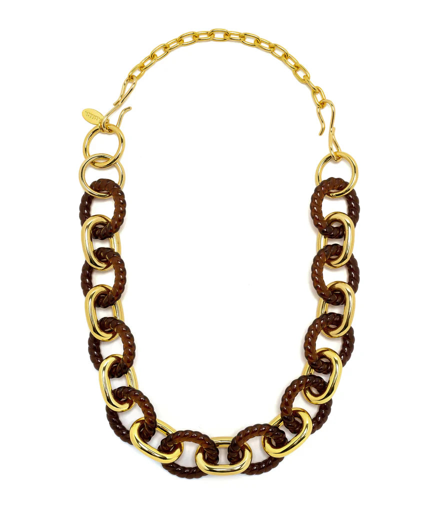 The Lizzie Fortunato Gold Extender Chain, 6.5", is a gold and brown chain-link necklace crafted from gold-plated brass with alternating large and small links. It includes a lobster clasp, features a branded tag, and pairs beautifully with Lizzie Fortunato necklace extenders for added versatility.