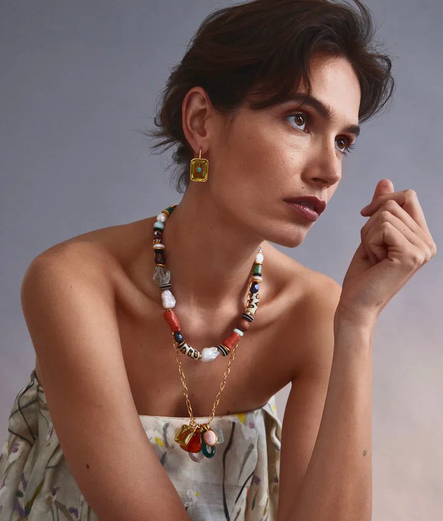 A woman wearing Lizzie Fortunato Tile Earrings and necklace.