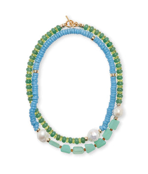 The Cabana Necklace by Lizzie Fortunato is a striking two-strand piece with alternating blue and green semiprecious beads, enhanced by gold accents and large pearl-like beads, offering a vibrant touch to any collection.