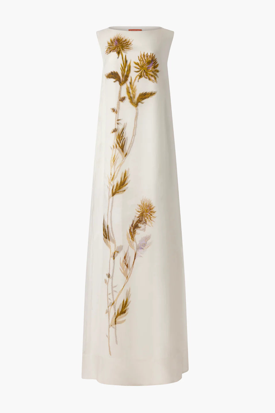 The Jools Dress by Altuzarra is a sleeveless, floor-length white silk dress with a vertical botanical print showcasing yellow and brown thistle flowers and leaves on the front.