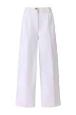 The Dash Pant by Altuzarra features a high waist, front button and zip closure, pressed center creases, and a modern cropped barrel-leg silhouette in wide-leg white tailoring.