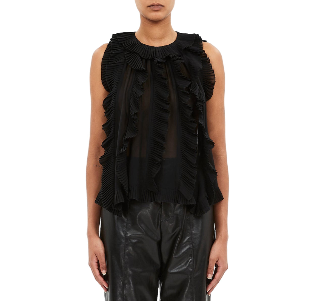 A model wears the Ulla Johnson Sabra Cascading Ruffle Top in black, paired with black leather pants, shown from the front against a white background.