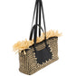The Lali Small East West Tote by Ulla Johnson features a black and beige checker pattern, fringed straw trim, black double handles, and a sleek leather accent—a chic raffia woven bag for any occasion.
