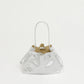 The Mansur Gavriel Drawstring Crinkle Pouchette is a small silver metallic bucket bag made from premium leather with thin handles, shown against a plain white background.