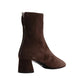 The Proenza Schouler Glove Suede Boot is a brown boot featuring a chunky block heel and a back zipper.