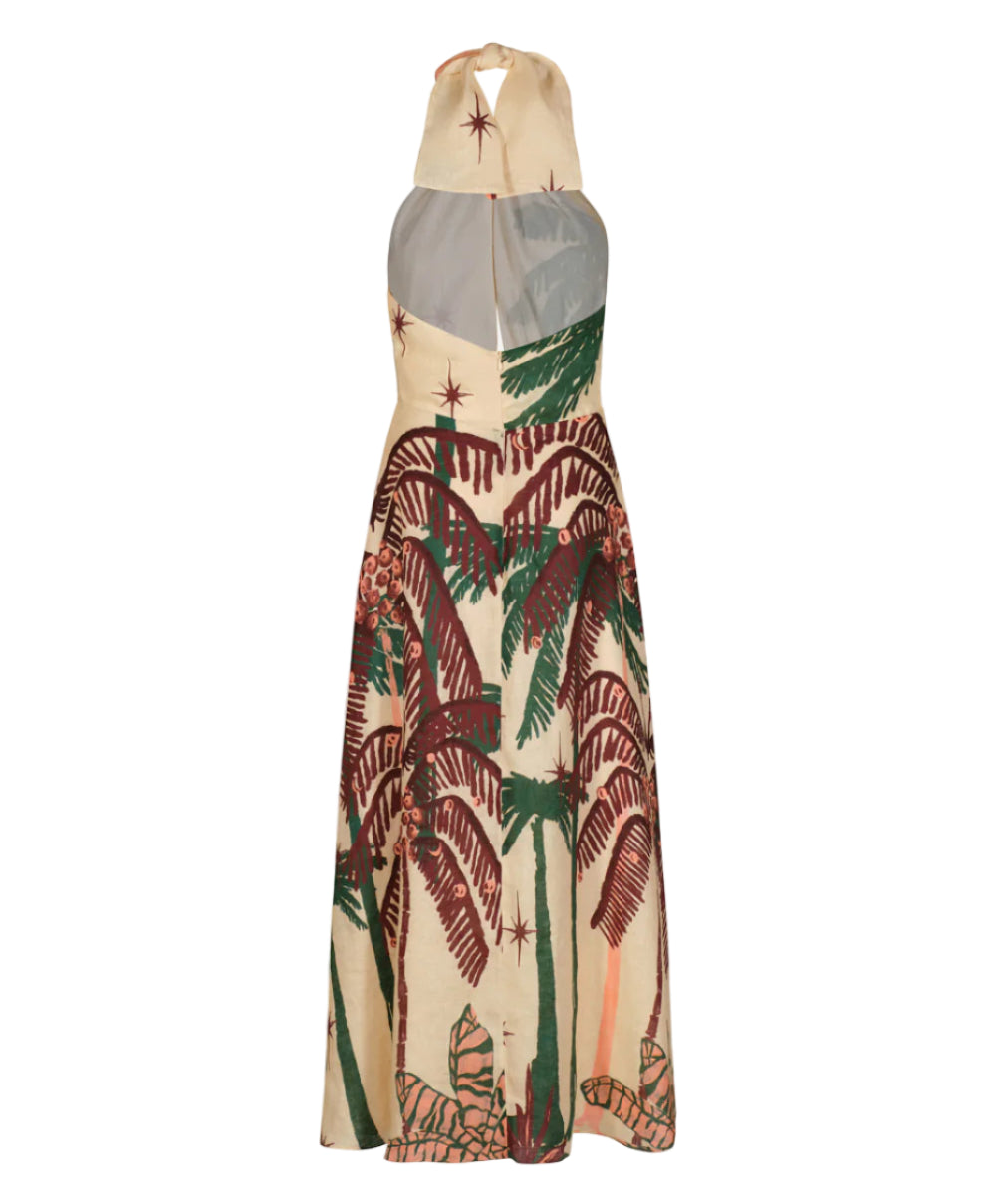 The Western Elements Ankle Dress by Johanna Ortiz is a sleeveless beige halter style with a hood, sheer back panel, and botanical green and brown palm tree print with scattered star designs, shown from the back.