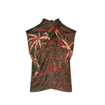The Mystic Shore Top by Johanna Ortiz is a sleeveless top with a twisted halter neckline, made from printed jacquard showcasing the brand’s signature dark green and red palm tree and building print.