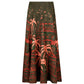 The Encanto De Isla Ankle Skirt by Johanna Ortiz is a high-waisted, ankle-length skirt with a flared silhouette, featuring a green base and red tropical cityscape print with palm trees and buildings.