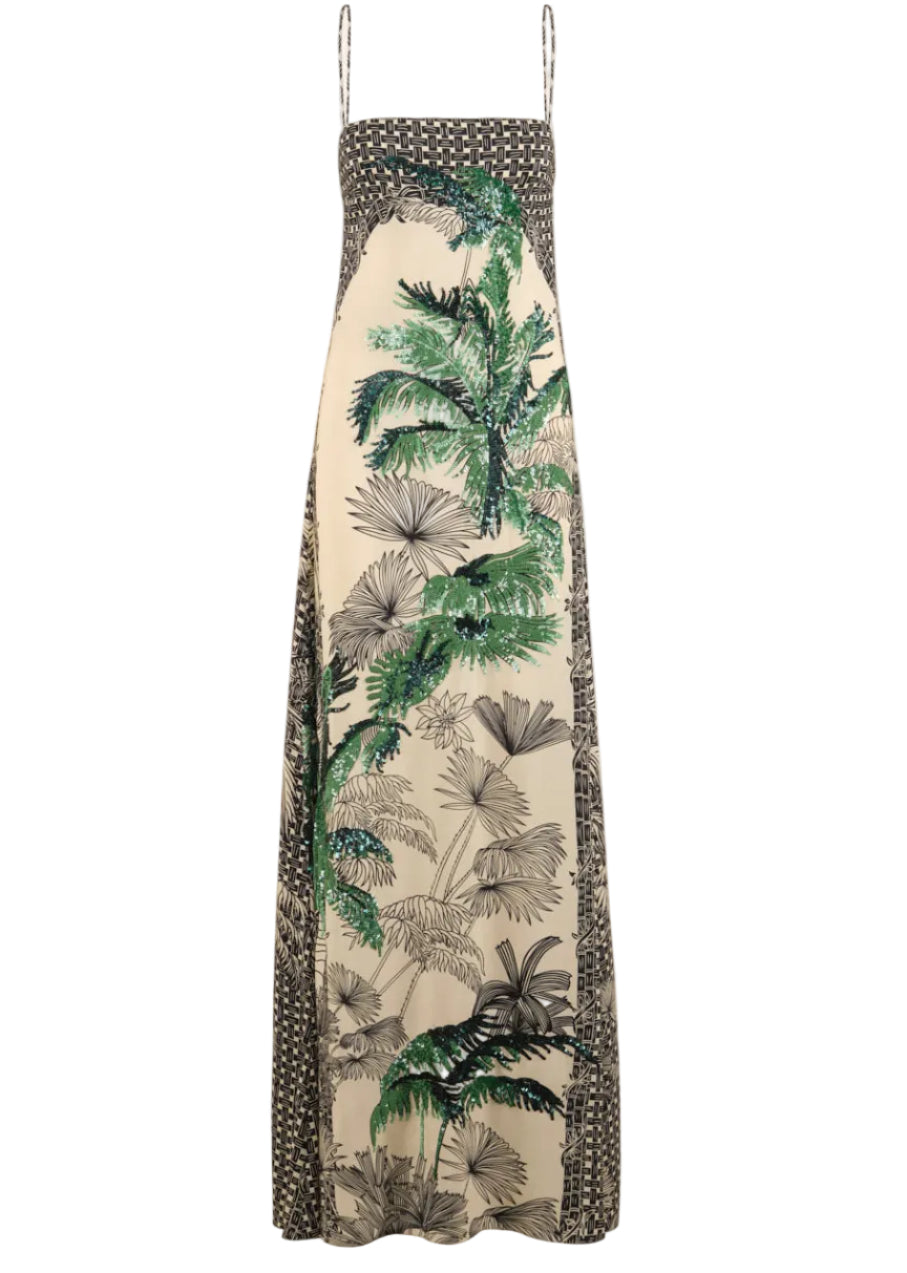 The Simbologia Floral Maxi Dress by Johanna Ortiz features a sleeveless design with thin straps, a cream base, black geometric borders, and green and black tropical motifs down the center for a striking look.