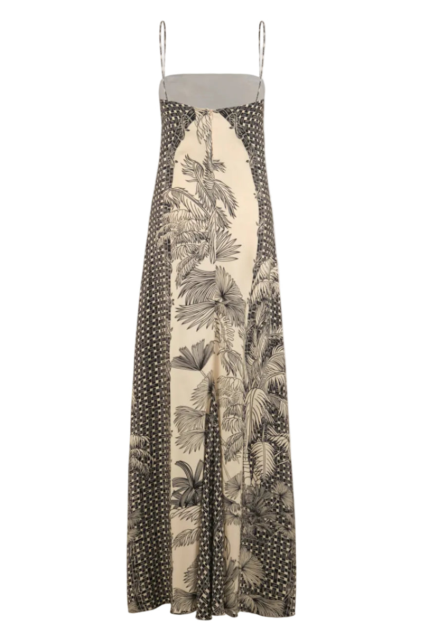 The Simbologia Floral Maxi Dress by Johanna Ortiz is a sleeveless maxi with thin straps, featuring a beige base decorated with black botanical, geometric, and subtle tropical patterns.