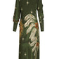 The Eternity Begins Wrap Dress by Johanna Ortiz is a long-sleeve green silk crêpe de chine dress featuring a JO print of palm leaves, stars, and berry clusters, shown from the back.
