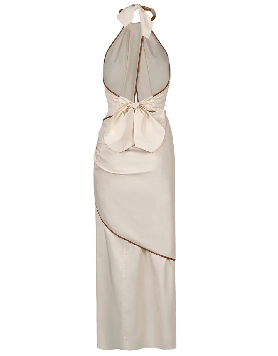 The Centro Del Cielo Ankle Dress by Johanna Ortiz is a beige halter-neck midi with an open back, large bow detail, brown trim, and asymmetric draping—a quiet luxury piece ideal for special occasions.