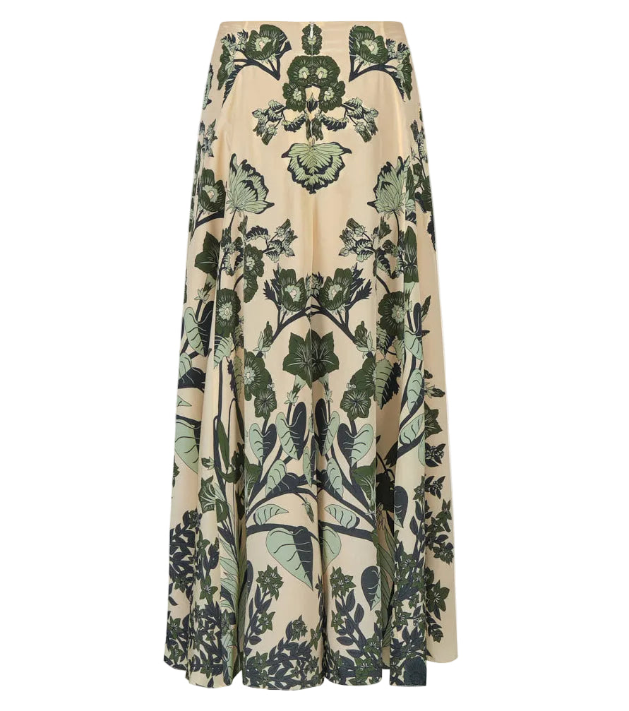 The Poems of the Sea Ankle Skirt by Johanna Ortiz features a beige botanical print with symmetrical green leaf motifs and an A-line silhouette, displayed against a white background.