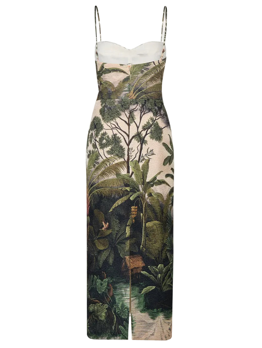 The Tropicana Ankle Dress by Johanna Ortiz is a sleeveless, fitted midi dress with thin straps, showcasing a lush Colombian landscape motif of green plants and trees for a nature-inspired look.