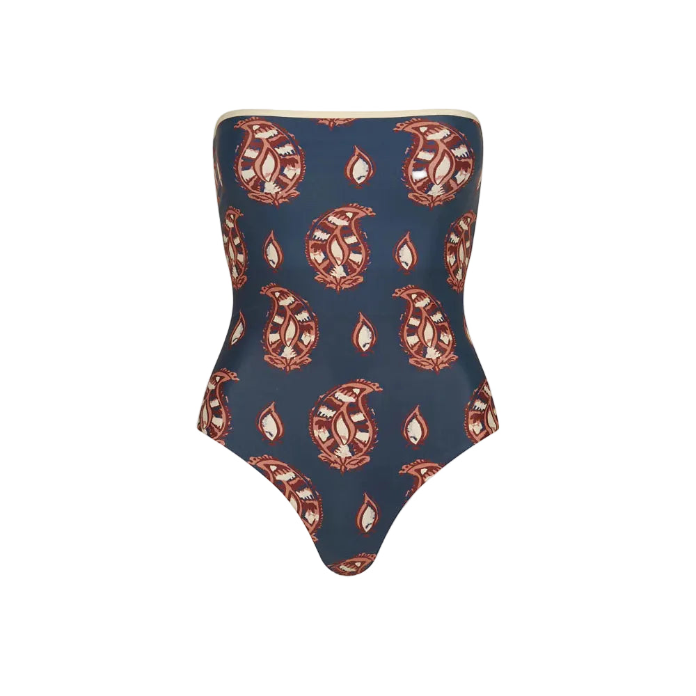 Alta Mar One Piece by Johanna Ortiz, a blue strapless swimsuit with a red and beige paisley pattern, perfect for summer swimwear and shown against a plain white background.