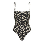 The Whispering Tides One Piece by Johanna Ortiz is a black one-piece swimsuit with thin straps, adorned with an abstract beige brushstroke JO print.