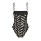 The Whispering Tides One Piece by Johanna Ortiz is a black swimsuit with thin straps and a bold white JO print reminiscent of leaves or chevrons.