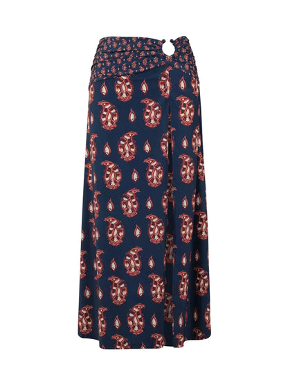 Under The Sun Ankle Skirt by Johanna Ortiz: a long navy blue maxi skirt featuring a red and white paisley JO print and a decorative ring at the waistband.