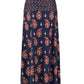 The Under The Sun Ankle Skirt by Johanna Ortiz is a long navy blue maxi skirt featuring a red and white paisley JO print and a comfortable smocked waistband.