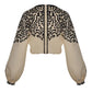 Johanna Ortiz Gentle Burn Top: cropped beige blouse with a black Ancient Markings print on the shoulders and sleeves, featuring a black center front placket.