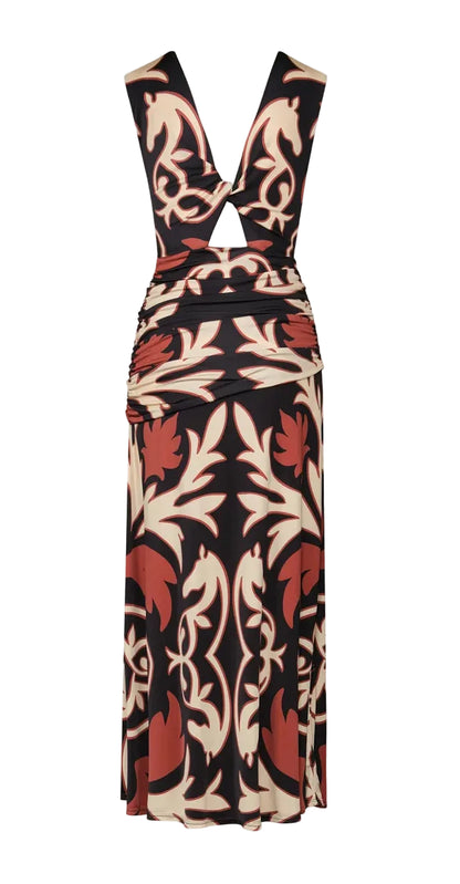 The Horizonte Mistico Midi Dress by Johanna Ortiz is a sleeveless, midi-length style with a front cutout and ruched waist, showcasing a striking brown, black, and cream abstract floral pattern inspired by the Equine Mola Tiles motif.