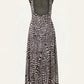 The Silent Rising Dress by Johanna Ortiz is a sleeveless, ankle-length piece crafted from soft double-sided jersey and adorned with a striking black and white External Feathers motif. This elegant dress features a large circular back cutout and a flowy skirt that adds graceful movement.