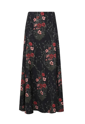 Black ankle-length Jacquard Encanto De Isla Ankle Skirt by Johanna Ortiz featuring a red and green botanical motif.