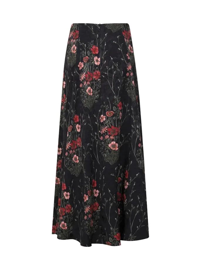 Johanna Ortiz Jacquard Encanto De Isla Ankle Skirt in black with a red and green botanical motif.