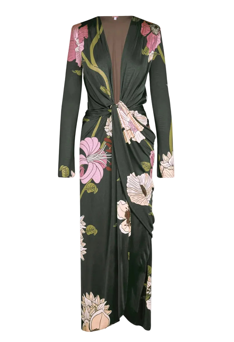 Johanna Ortiz Reinvention Oasis Ankle Dress: a dark green, ankle-length, long-sleeved shiny jersey dress with a pink and white botanical motif, deep V-neck, and knotted front detail.