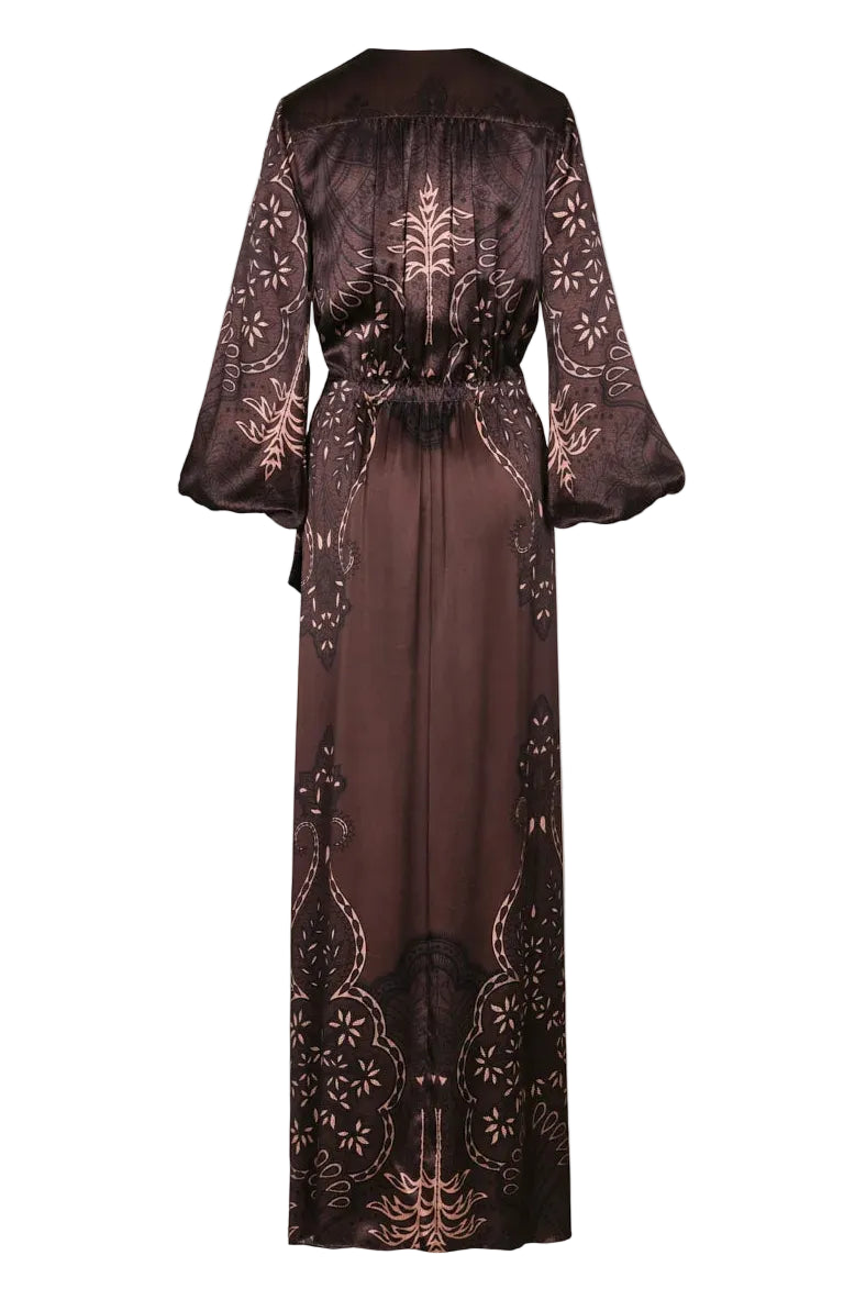 Back view of the brown, long-sleeved Timeless Concurse Wrap Dress featuring a pink and black botanical motif.
