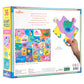 Back of Eeboo's Alphabet 36 Piece Giant Puzzle box displays a vibrant finished puzzle with illustrated alphabet tiles and animals by Sarah Walsh, plus a hand holding a large piece for size reference.
