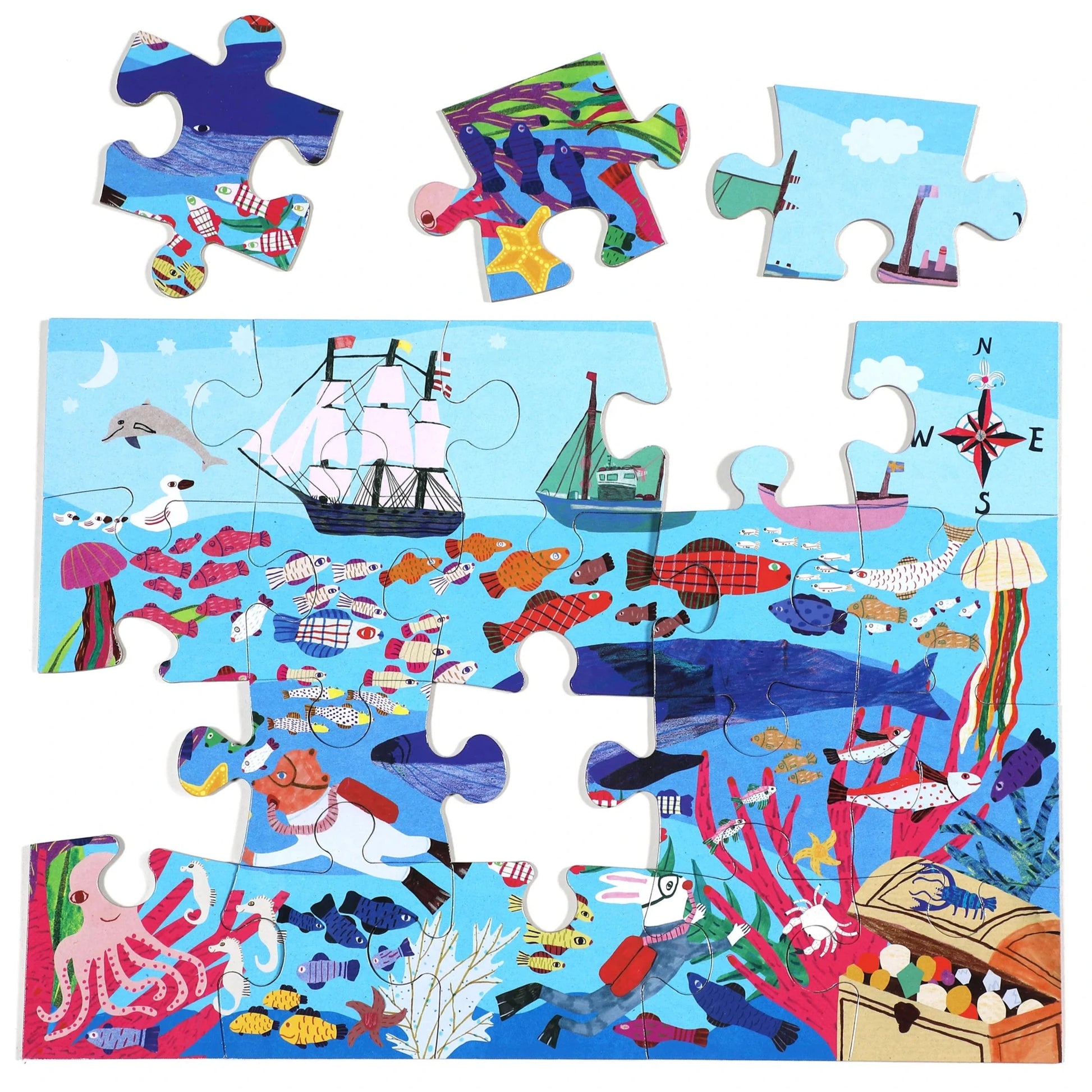 The Eeboo Sea Exploration 20 Piece Big Puzzle for kids features sea creatures, fish, a ship, a boat, a compass rose, and part of a treasure chest. Four colorful pieces are shown above this fun ocean-themed puzzle.